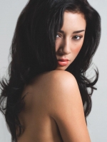 Side profile of Chloe's luscious waves and makeup. Chloe-Hair and Makeup Model