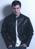 His hair was parted on the side for the 50's look for this photo shoot. Conner-Hair and Makeup Model