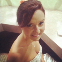 An elegant updo and soft, natural makeup look great on Carol for her special day. Carol-Bride